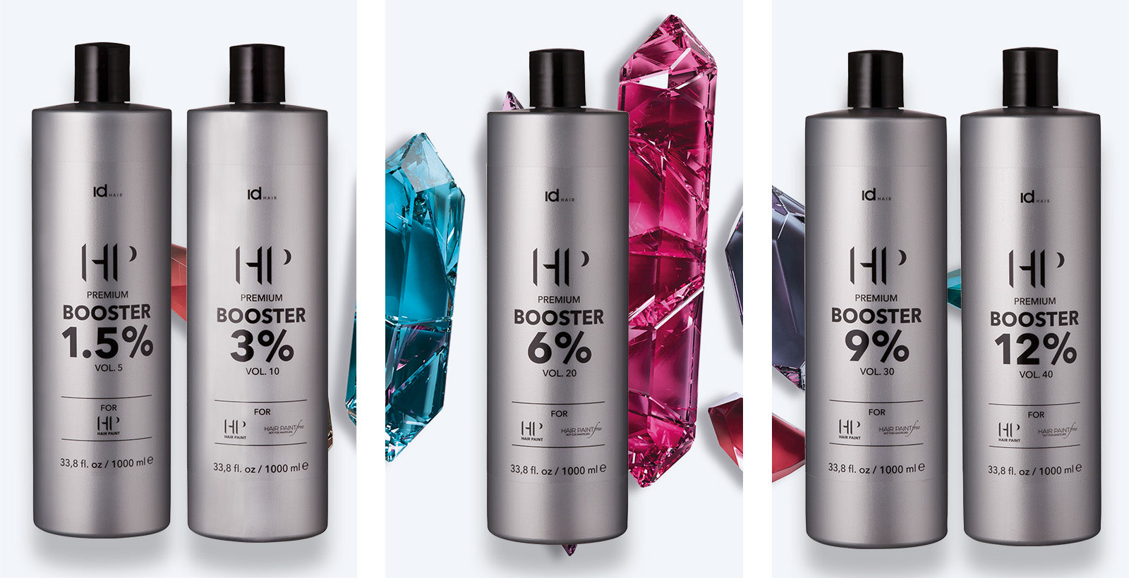IdHAIR HP Premium Booster-flasker i sølvdesign foran farvede krystaller.